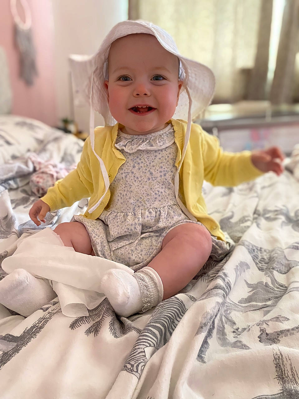 Veronica-bleu is registered to the contest to win money with this photo: baby, baby_toddler_clothing, chair, child, comfort, dress, eye, face, fun, happy, headwear, human_leg, iris, joy, leg, person, pink, skin, sleeve, smile