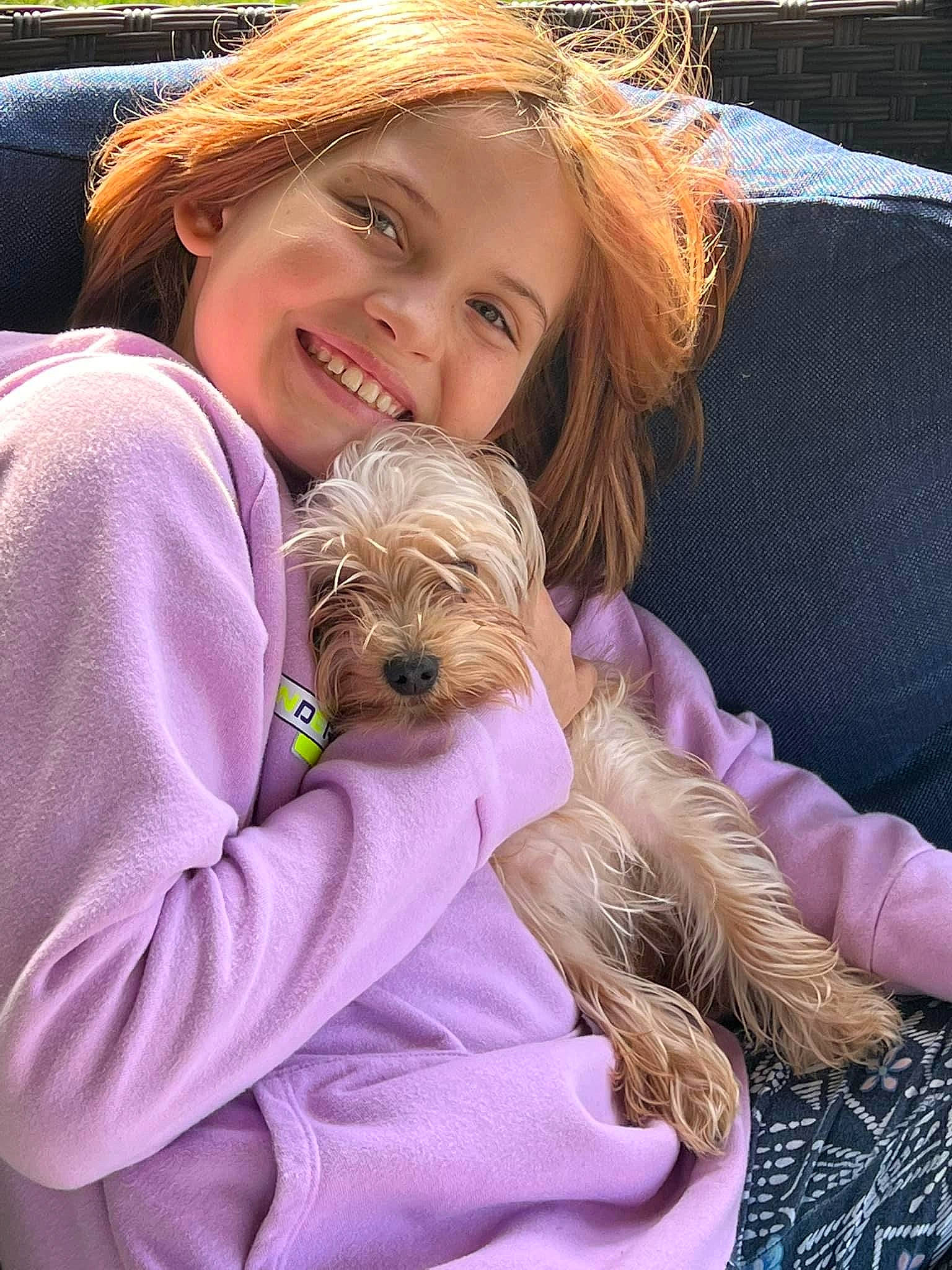 Aleah is registered to the contest to win money with this photo: blond, canidae, carnivore, child, companion_dog, dog, dog_breed, fawn, fur, happy, hat, joy, liver, person, sitting, small_terrier, smile, sporting_group, sun_hat, terrier