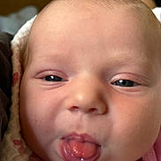 Poetri is registered to the contest to win money with this photo: baby, face, tongue, close_up, infant, skin, eyes, blanket, cute, expression, mouth, newborn, person, head, soft_lighting, cheeks, pink, clothing, tongue_out, portrait