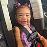 toddler, child, car_seat, smiling, pink_bows, hair_accessories, seatbelt, striped_clothing, happy, baby, safety, car_interior, cute, person, infant, young_child, portrait, seat, cute_expression, secure
