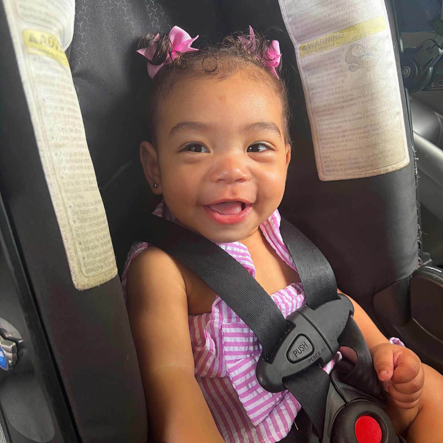 Isabella joined the competition — help win amazing prizes! toddler, child, car_seat, smiling, pink_bows, hair_accessories, seatbelt, striped_clothing, happy, baby, safety, car_interior, cute, person, infant, young_child, portrait, seat, cute_expression, secure