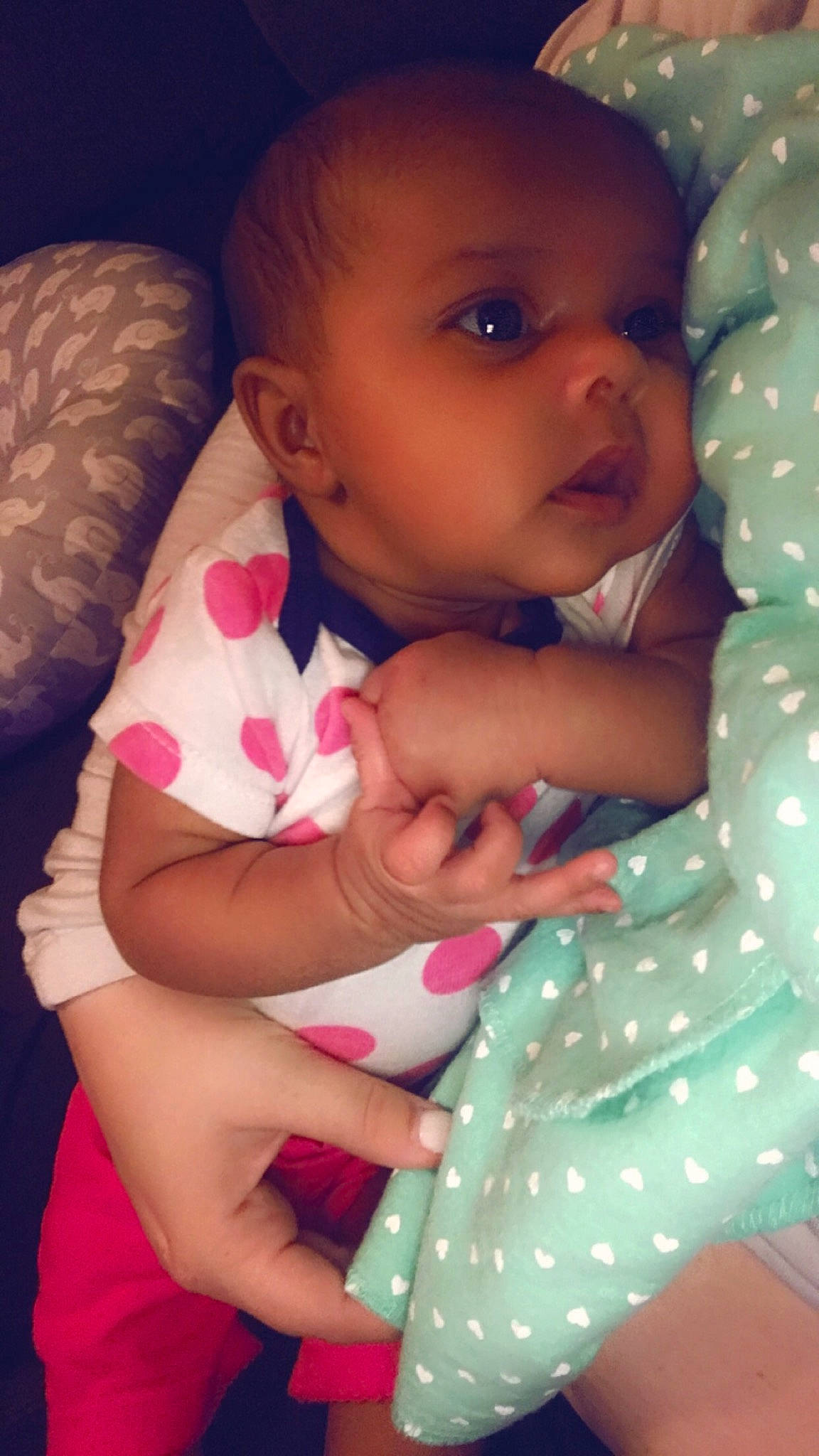 Aalayah is registered to the contest to win money with this photo: arm, baby, baby_toddler_clothing, cheek, comfort, finger, gesture, hand, happy, iris, lip, mouth, neck, nose, person, pink, purple, skin, sleeve, textile