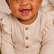Lakenya joined the competition — help win amazing prizes! baby, child, smiling, headband, bow, curly_hair, sitting, carpet, plush_toy, teddy_bear, neutral_colors, long_sleeve, onesie, cute, portrait, indoors, happy, infant, soft_texture, cozy