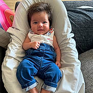 Charlie participe au concours pour gagner de l'argent avec cette photo : baby, barefoot, blue_jeans, casual_clothing, child, cozy, cute, happy, home, indoor, infant, person, portrait, relaxed, seated, smiling, soft_fabric, white_cushion, wood_floor, young