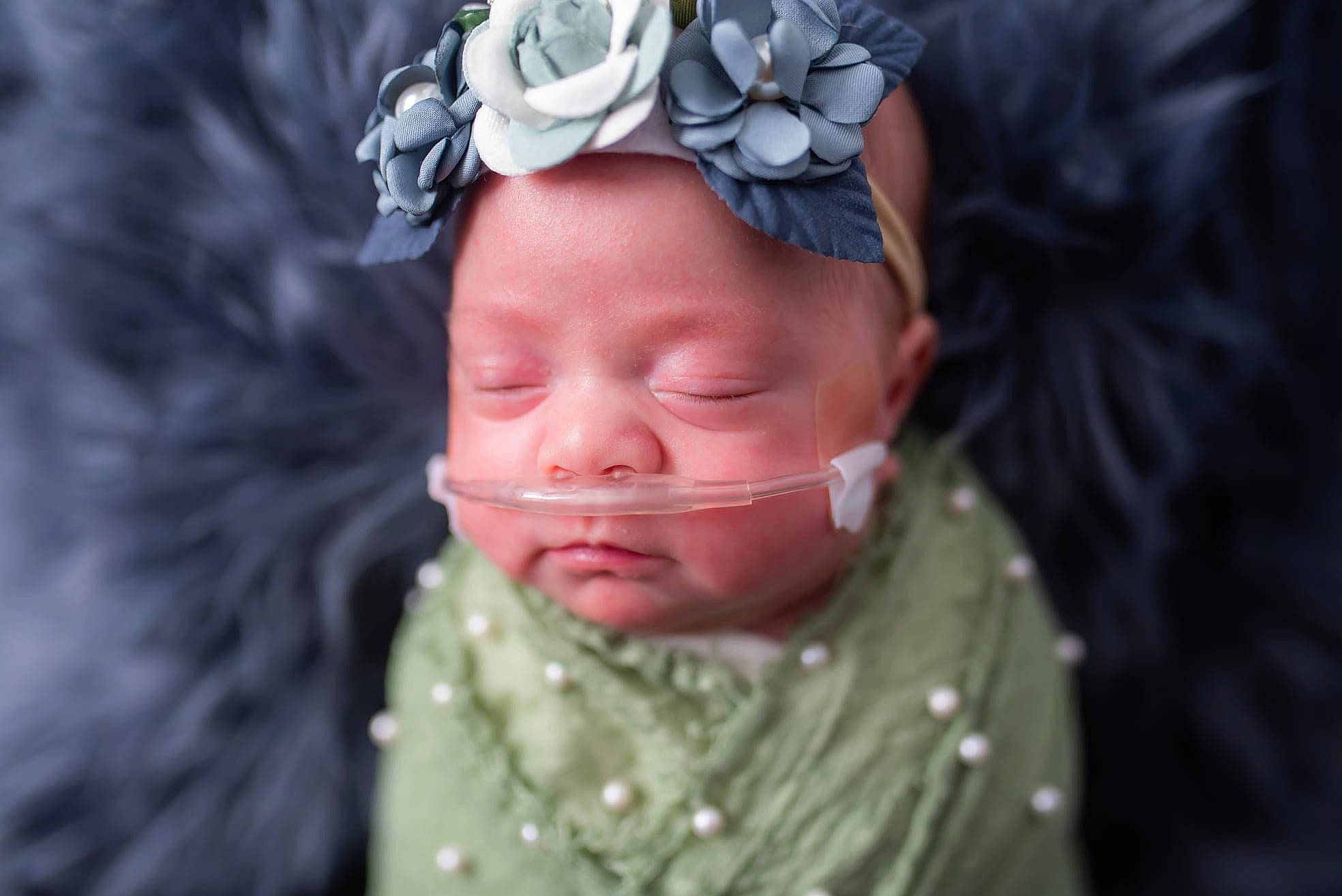 Reaslynn is registered to the contest to win money with this photo: baby, baby_toddler_clothing, cap, chin, eye, eyebrow, eyelash, face, finger, flower, happy, hat, headgear, headwear, iris, lip, person, petal, pink, sleeve