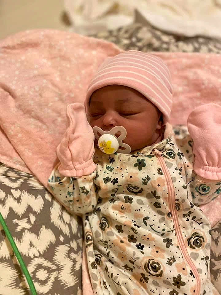 Araya joined the competition — help win amazing prizes! baby, baby_products, baby_sleeping, baby_toddler_clothing, bedding, cap, child, comfort, facial_expression, happy, hat, headwear, linens, mammal, military_camouflage, pattern, person, skin, sleeve, textile