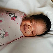 Nymeria is registered to the contest to win money with this photo: architecture, baby, bed, bedroom, blanket, cushion, face, furniture, happy, head, homedecor, indoors, newborn, person, photography, portrait, quilt, room, sleeping, smile