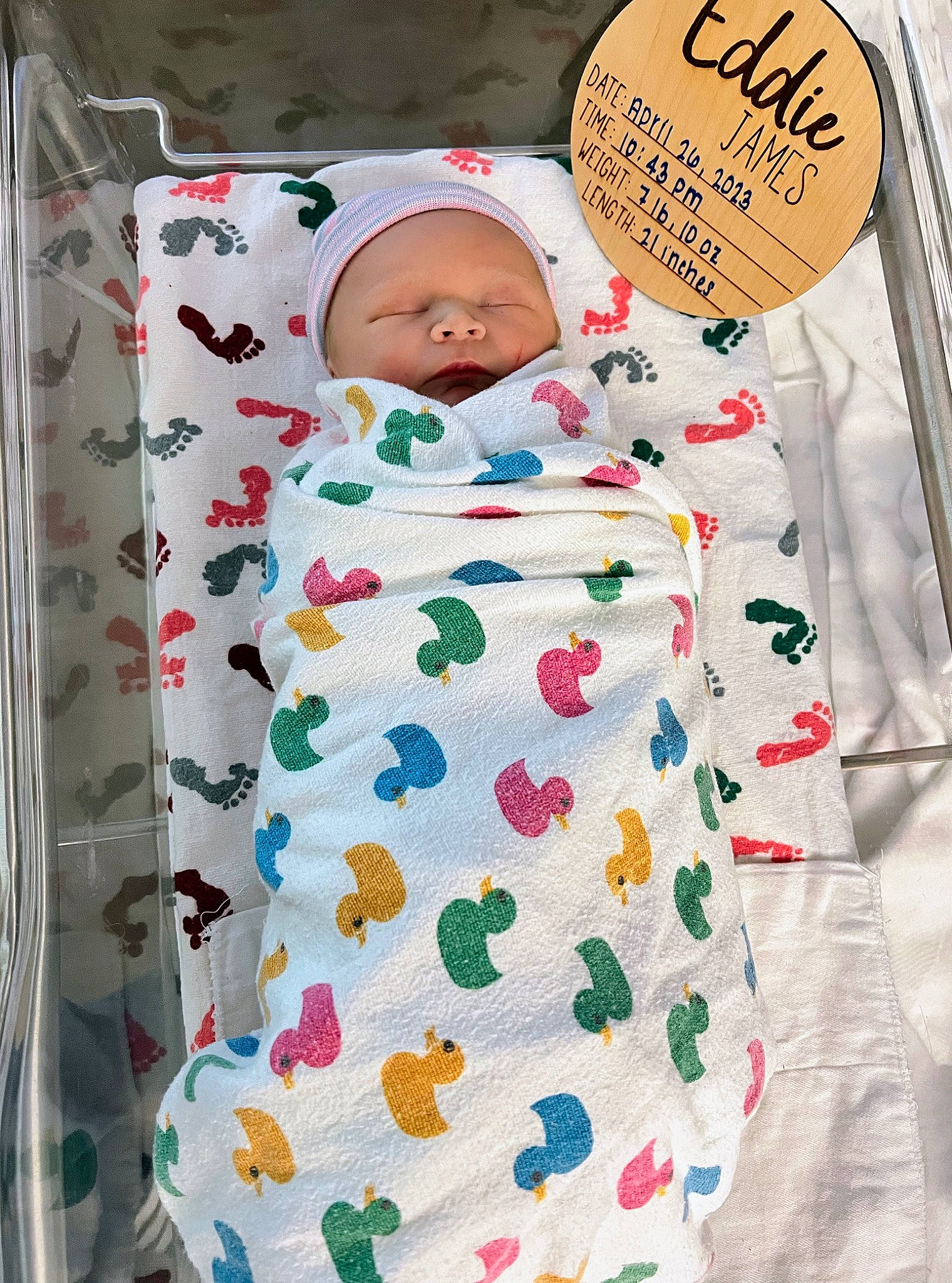 Eddie is registered to the contest to win money with this photo: baby, baby_products, baby_sleeping, baby_toddler_clothing, bed_sheet, bedding, child, comfort, font, hat, illustration, linens, pattern, person, product, room, sleeve, t_shirt, textile, toddler