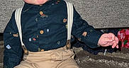 Bryer is registered to the contest to win money with this photo: adorable, baby, button_up_shirt, carpet, child, couch, fashion, flash_photography, furniture, home, indoors, infant, portrait, rug, serious_expression, sitting, suspenders, tan_pants, white_socks, wide_eyed