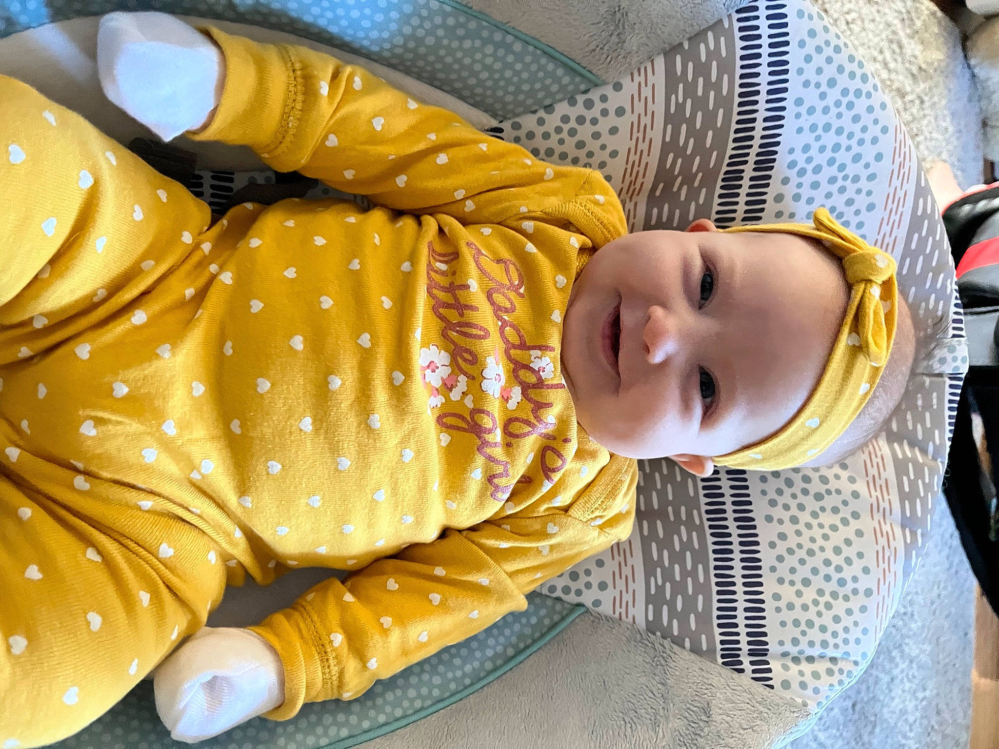 Mckenna is registered to the contest to win money with this photo: baby, baby_carriage, baby_products, baby_toddler_clothing, cheek, child, comfort, grass, joy, nap, pattern, person, sitting, sleep, toddler, tree, wood