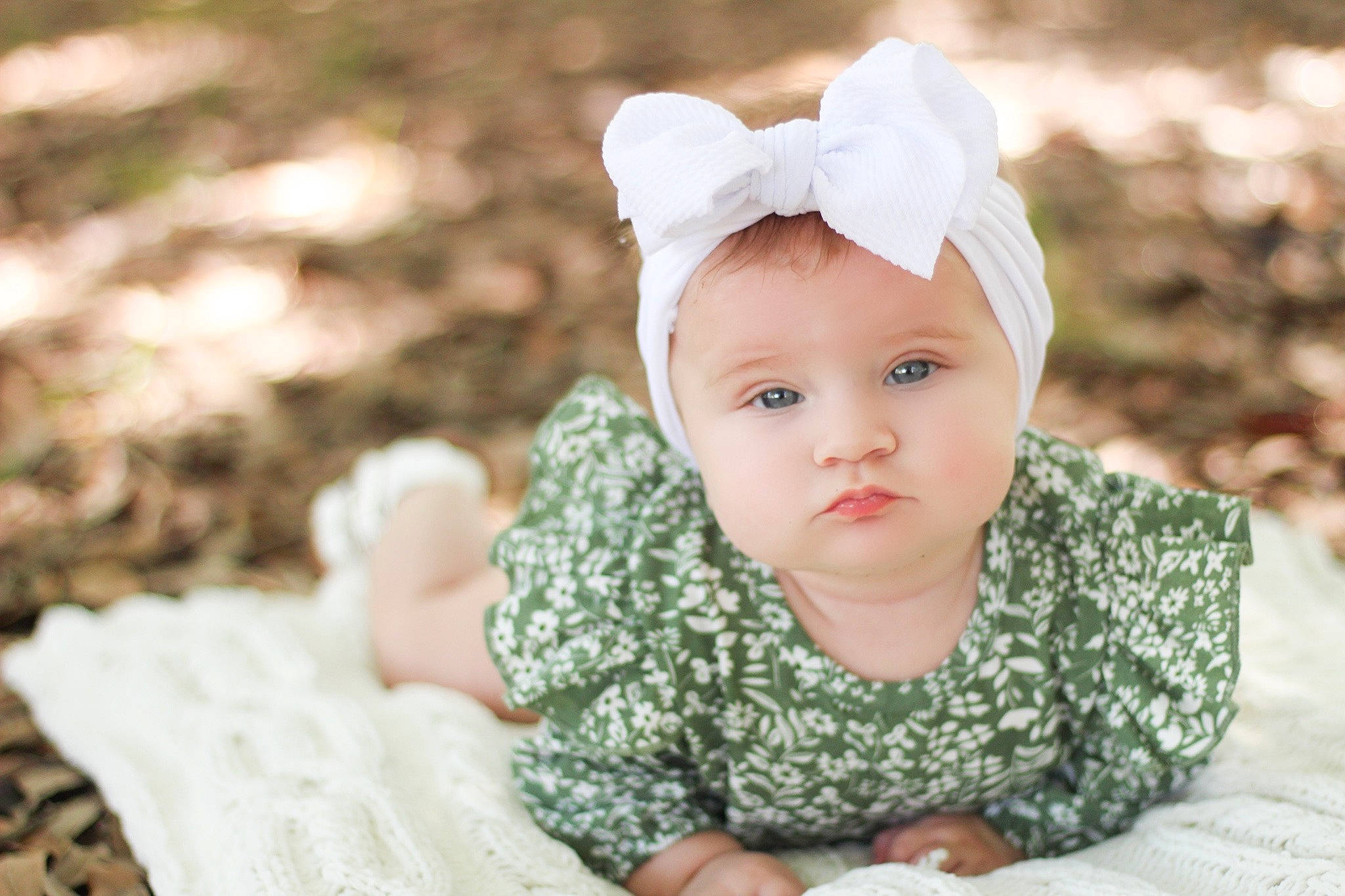 Sadie Mae is registered to the contest to win money with this photo: baby, baby_toddler_clothing, cap, cheek, child, fashion_accessory, flash_photography, grass, happy, head, headgear, headwear, iris, lip, monochrome, monochrome_photography, people_in_nature, person, portrait_photography, sitting