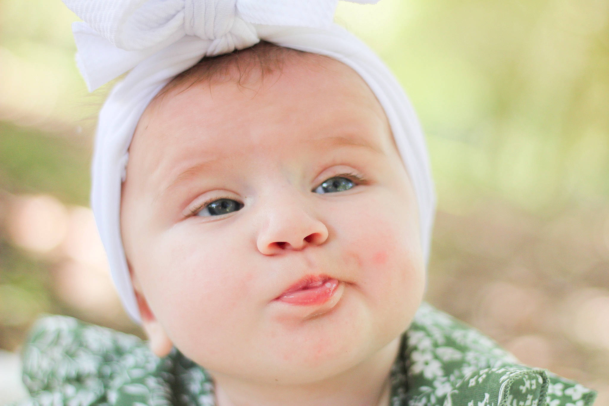 Sadie Mae joined the competition — help win amazing prizes! baby, beauty, cheek, child, close_up, eyebrow, eyelash, flash_photography, grass, happy, headgear, human_body, lip, nose, people_in_nature, person, plant, skin, smile, toddler