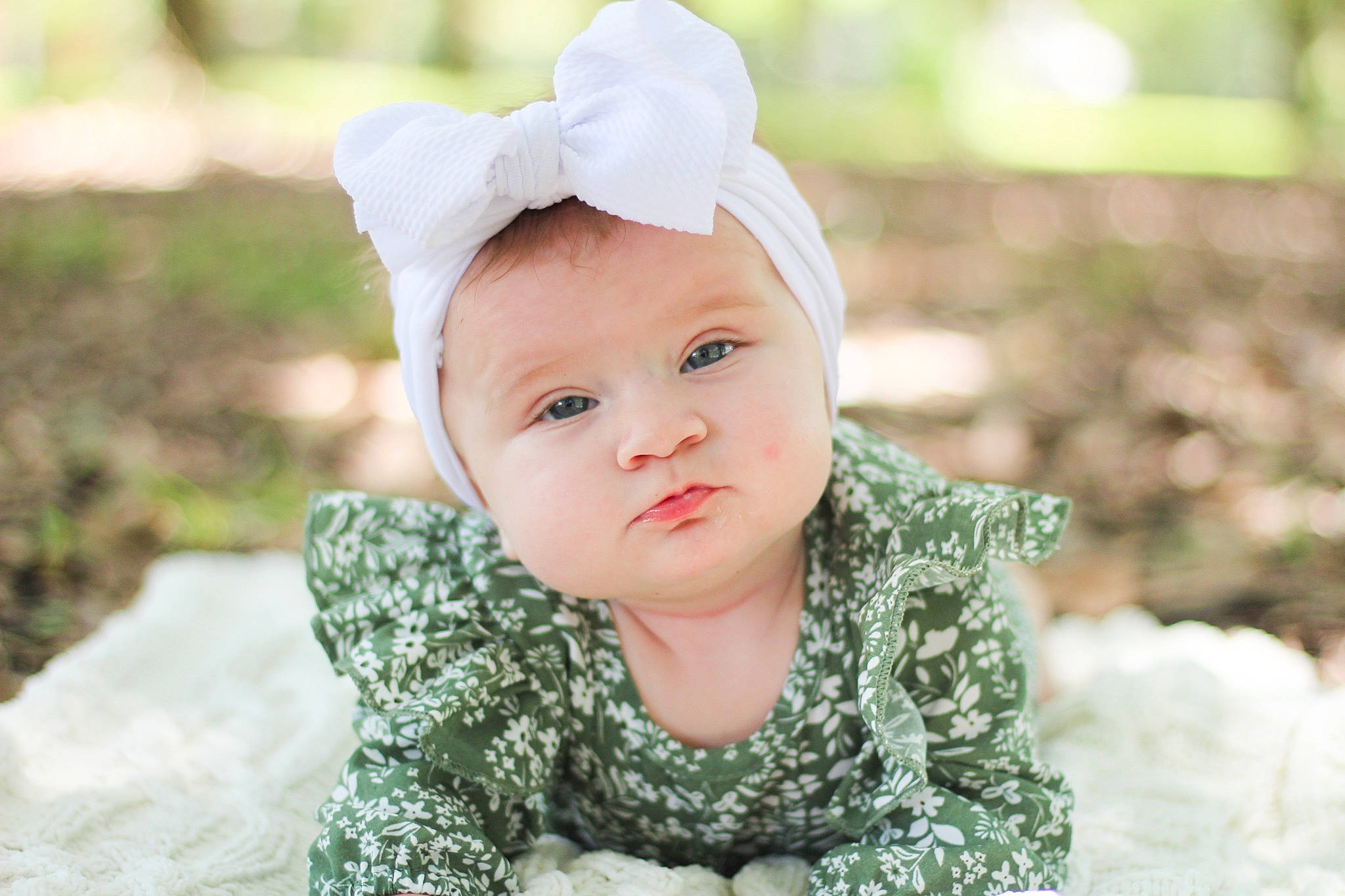 Sadie Mae is registered to the contest to win money with this photo: baby, baby_toddler_clothing, beauty, cap, child, face, fashion_accessory, flash_photography, grass, happy, headwear, leaf, lip, monochrome_photography, pattern, people_in_nature, person, portrait_photography, sitting, sleeve