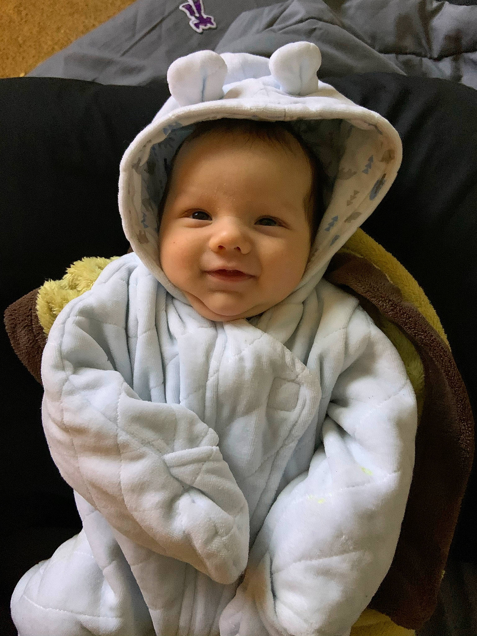 Javier is registered to the contest to win money with this photo: baby, baby_products, baby_toddler_clothing, bonnet, cheek, child, comfort, costume_accessory, costume_hat, fur, headwear, hood, hoodie, human, linens, person, skin, sleeve, textile, toddler
