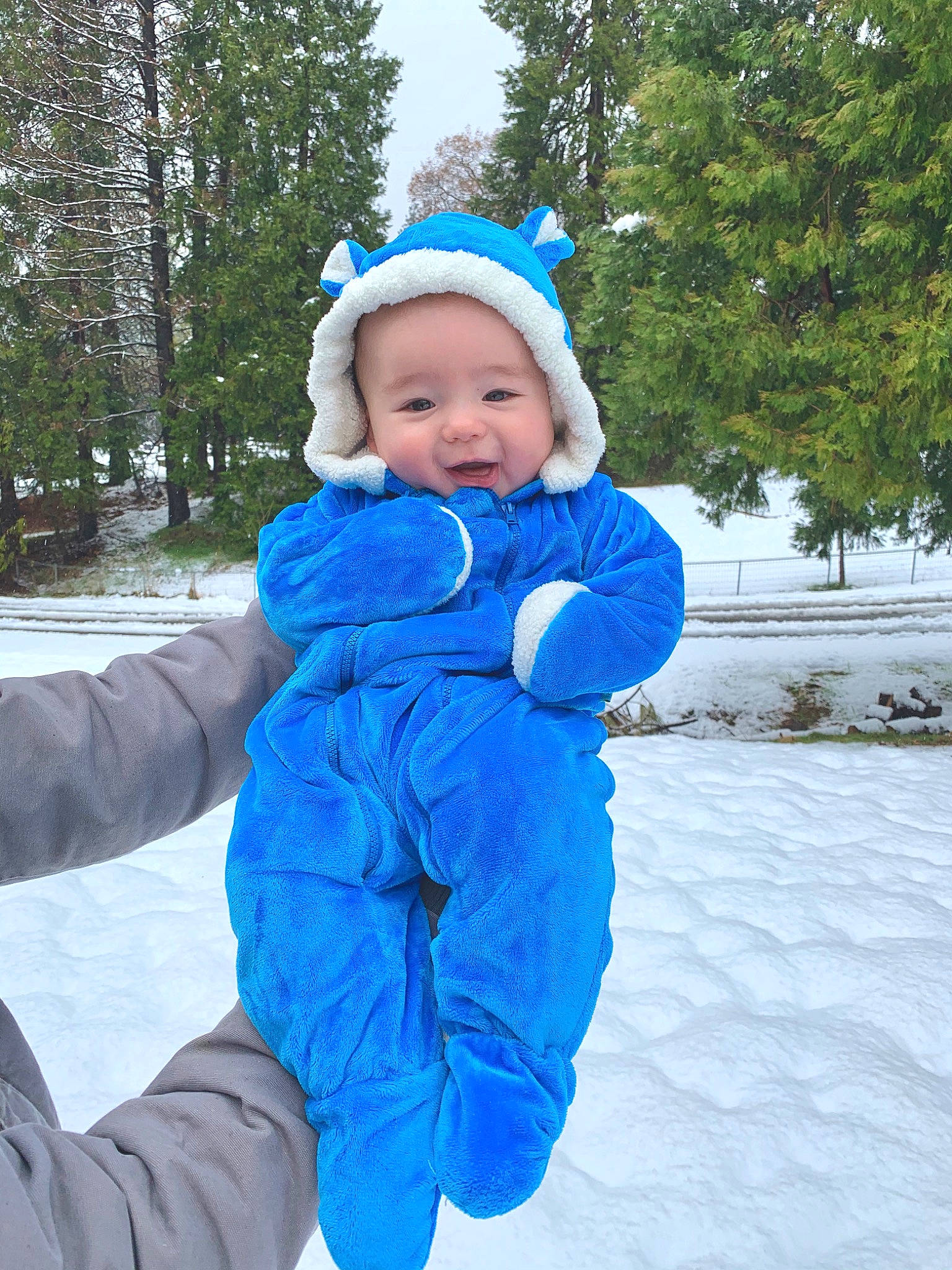 Hudson joined the competition — help win amazing prizes! baby, blue, child, freezing, fun, glove, headgear, headwear, hood, jacket, outerwear, person, play, playing_in_the_snow, recreation, smile, snow, toddler, vacation, winter