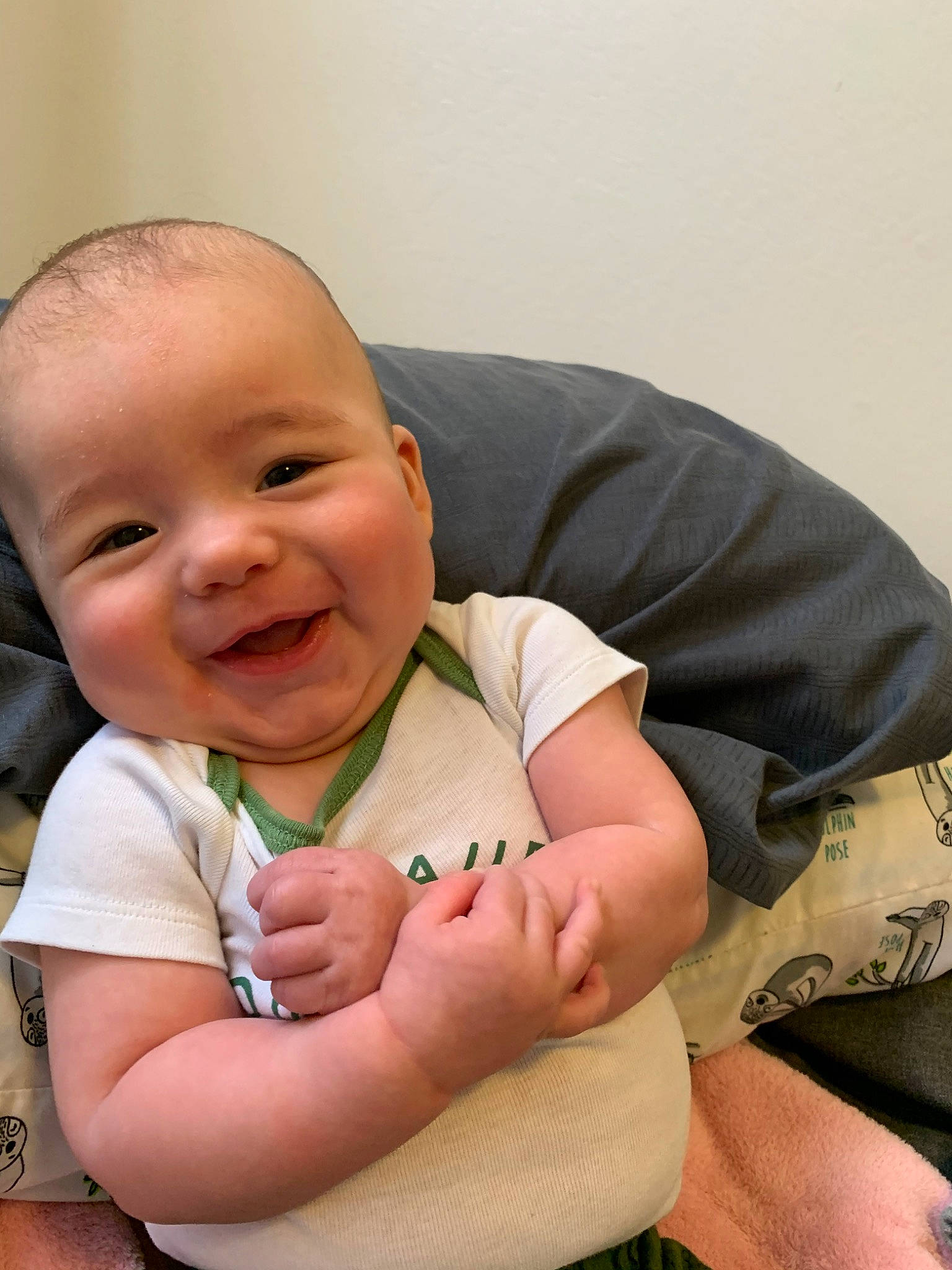 Hudson is registered to the contest to win money with this photo: arm, baby, cheek, child, chin, face, facial_expression, finger, gesture, hand, head, joy, leg, lip, muscle, nose, person, sitting, skin, smile