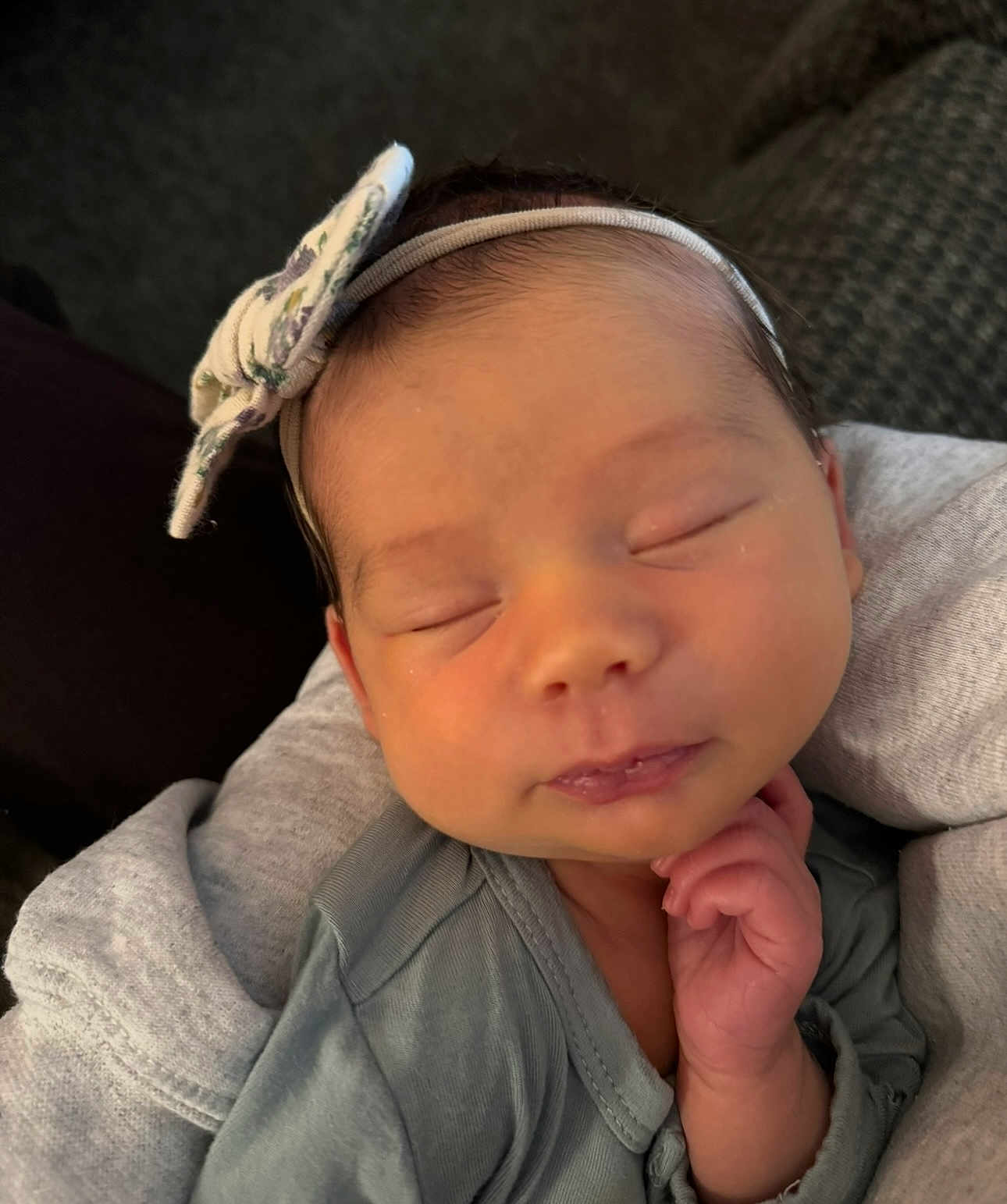 Nora joined the competition — help win amazing prizes! baby, newborn, sleeping, headband, bow, hand, face, clothing, blanket, cozy, infant, peaceful, portrait, closeup, cute, skin, person, resting, indoors, soft
