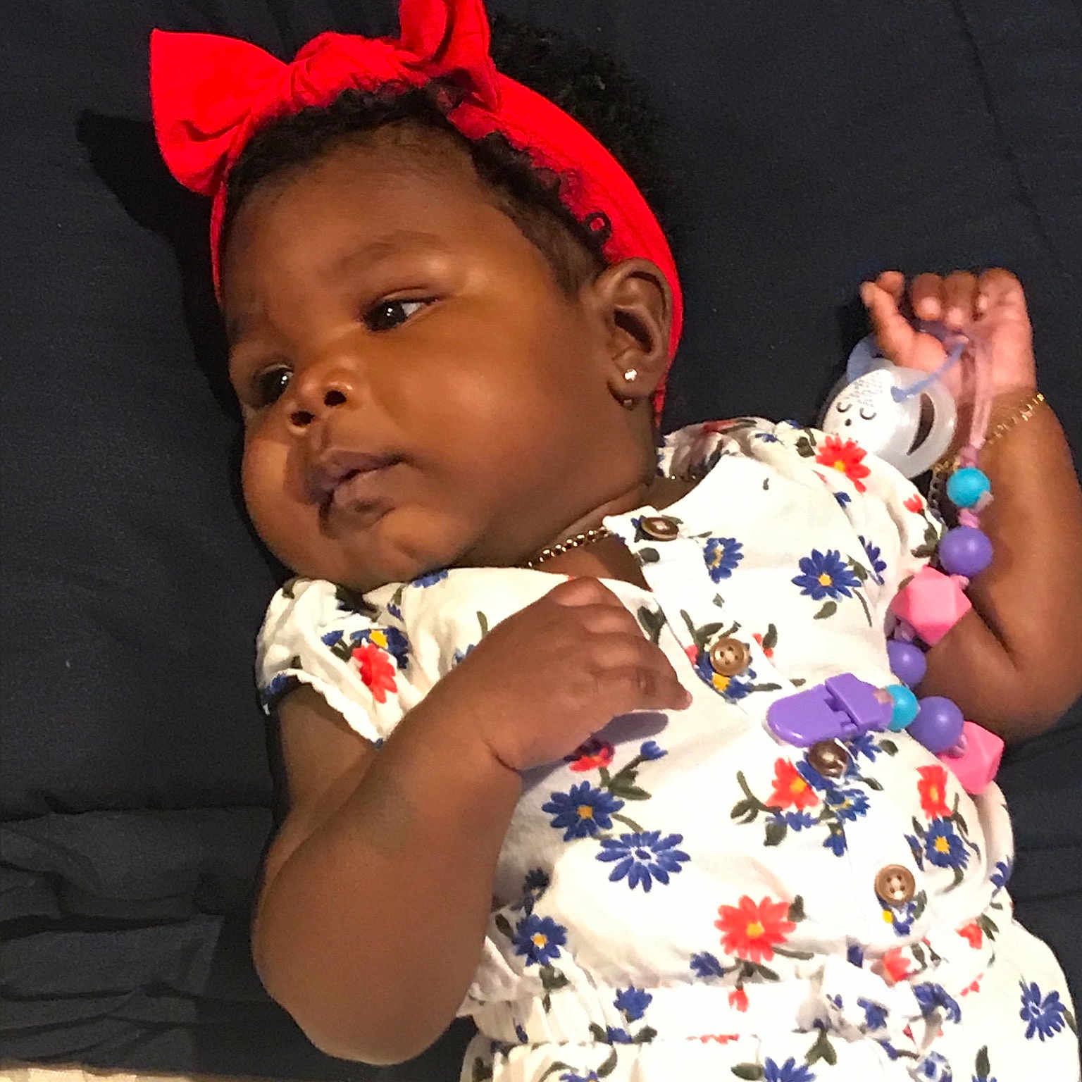 Justyce is registered to the contest to win money with this photo: baby, cheek, child, ear, hair_accessory, headgear, person, toddler