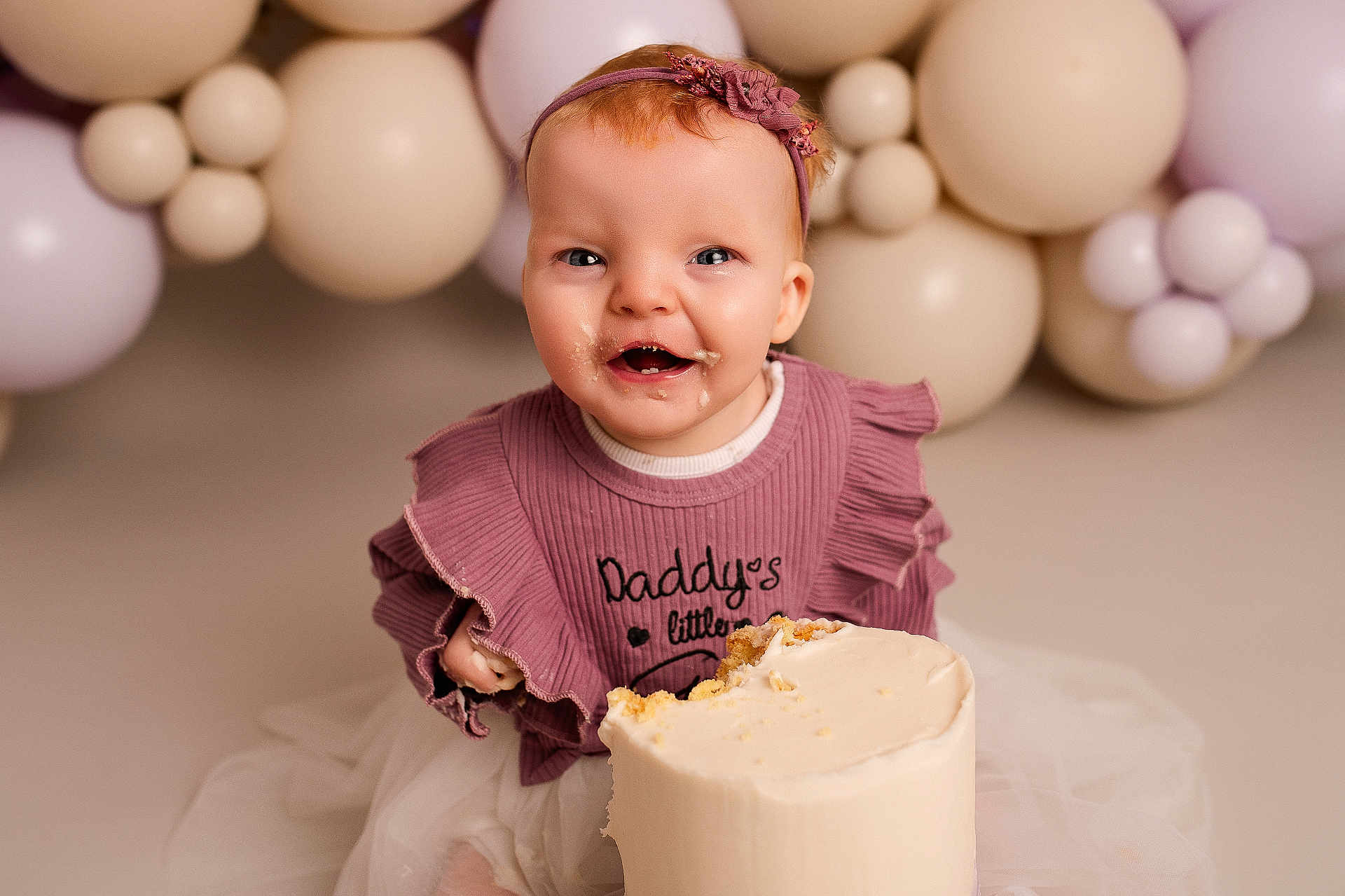 Bryer joined the competition — help win amazing prizes! baby, child, cake, birthday, smiling, headband, purple_dress, frosting, face, happy, balloons, celebration, sitting, cute, party, young_child, background, food, sweet, messy