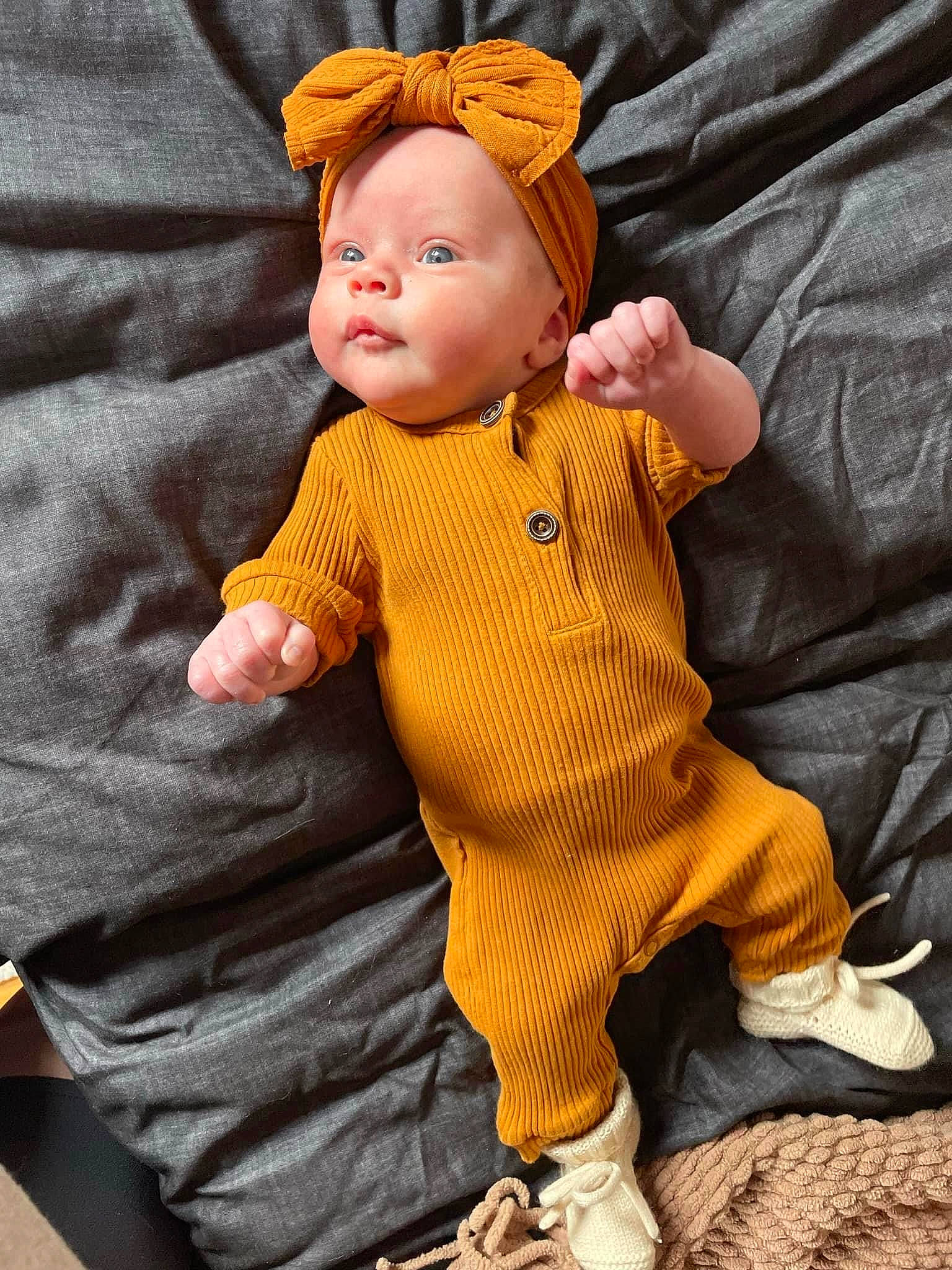 Ariyah is registered to the contest to win money with this photo: art, baby, baby_toddler_clothing, cheek, child, doll, gesture, hand, head, knit_cap, orange, pattern, peach, person, sitting, sleeve, textile, thumb, toy, vintage_clothing