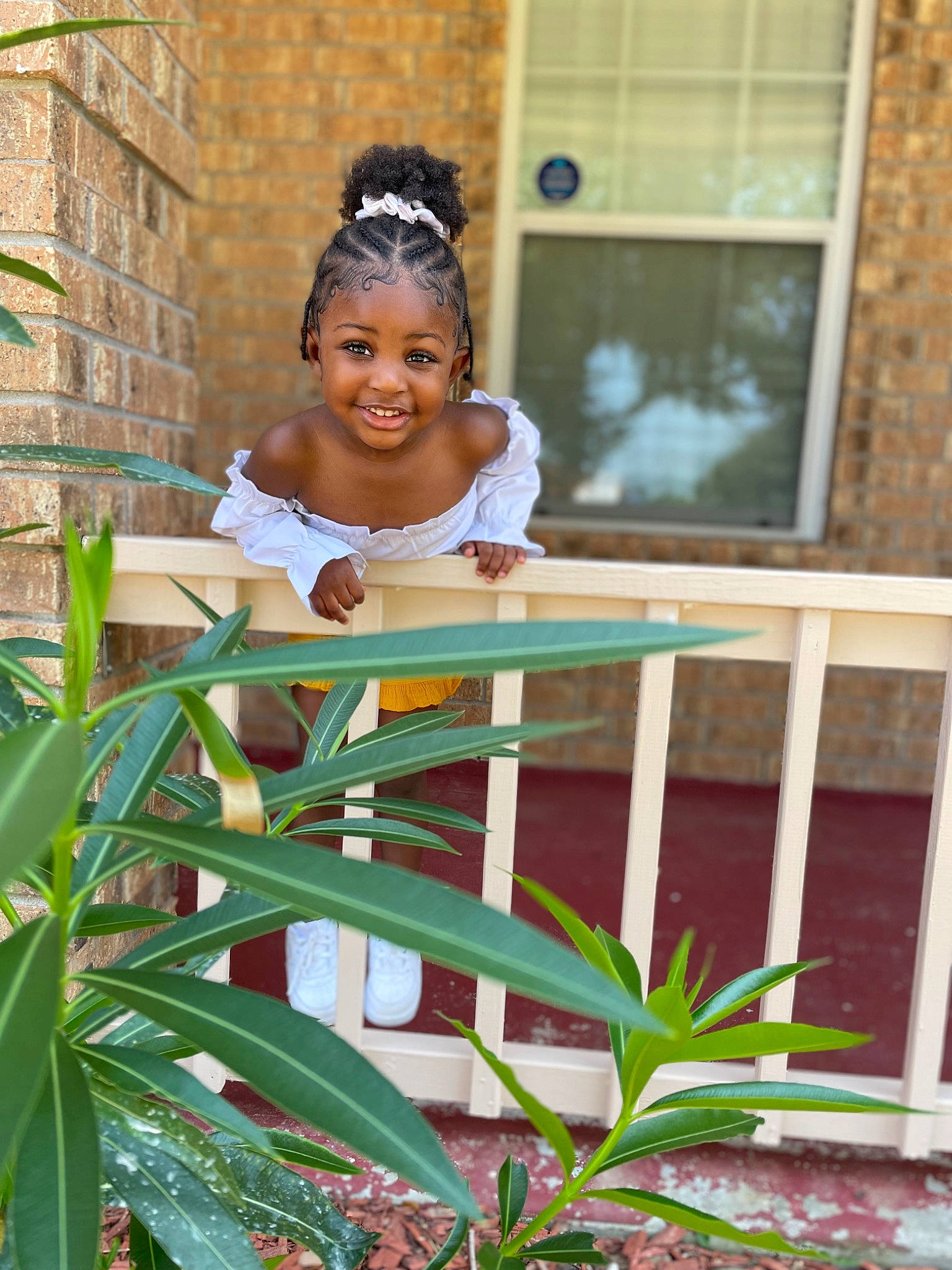 Elysia is registered to the contest to win money with this photo: baby, child, dress, fun, garden, grass, happy, house, human_body, joy, leisure, person, plant, plant_stem, sitting, smile, t_shirt, terrestrial_plant, toddler, tree