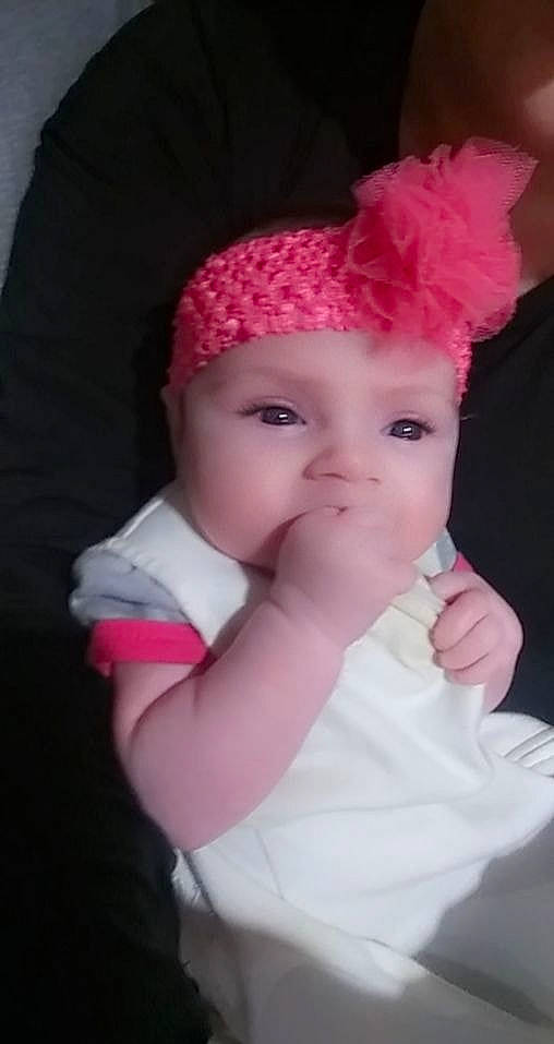 Luciana is registered to the contest to win money with this photo: baby, bonnet, cheek, child, clothing, costume_accessory, costume_hat, fashion_accessory, hair_accessory, hat, head, headgear, headwear, knit_cap, lip, nose, person, pink, skin, toddler