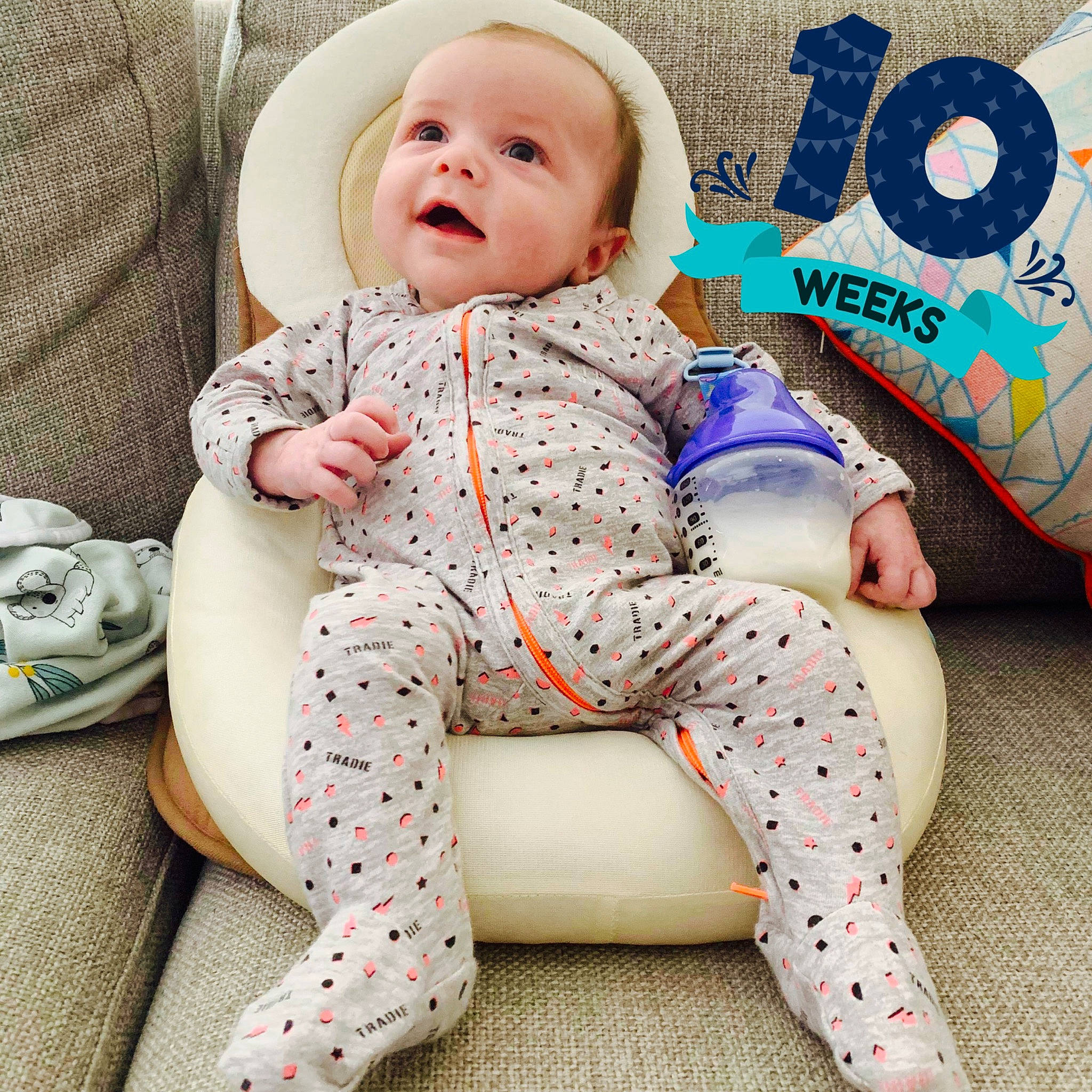 Julien is registered to the contest to win money with this photo: baby, child, design, pattern, person, sitting, toddler