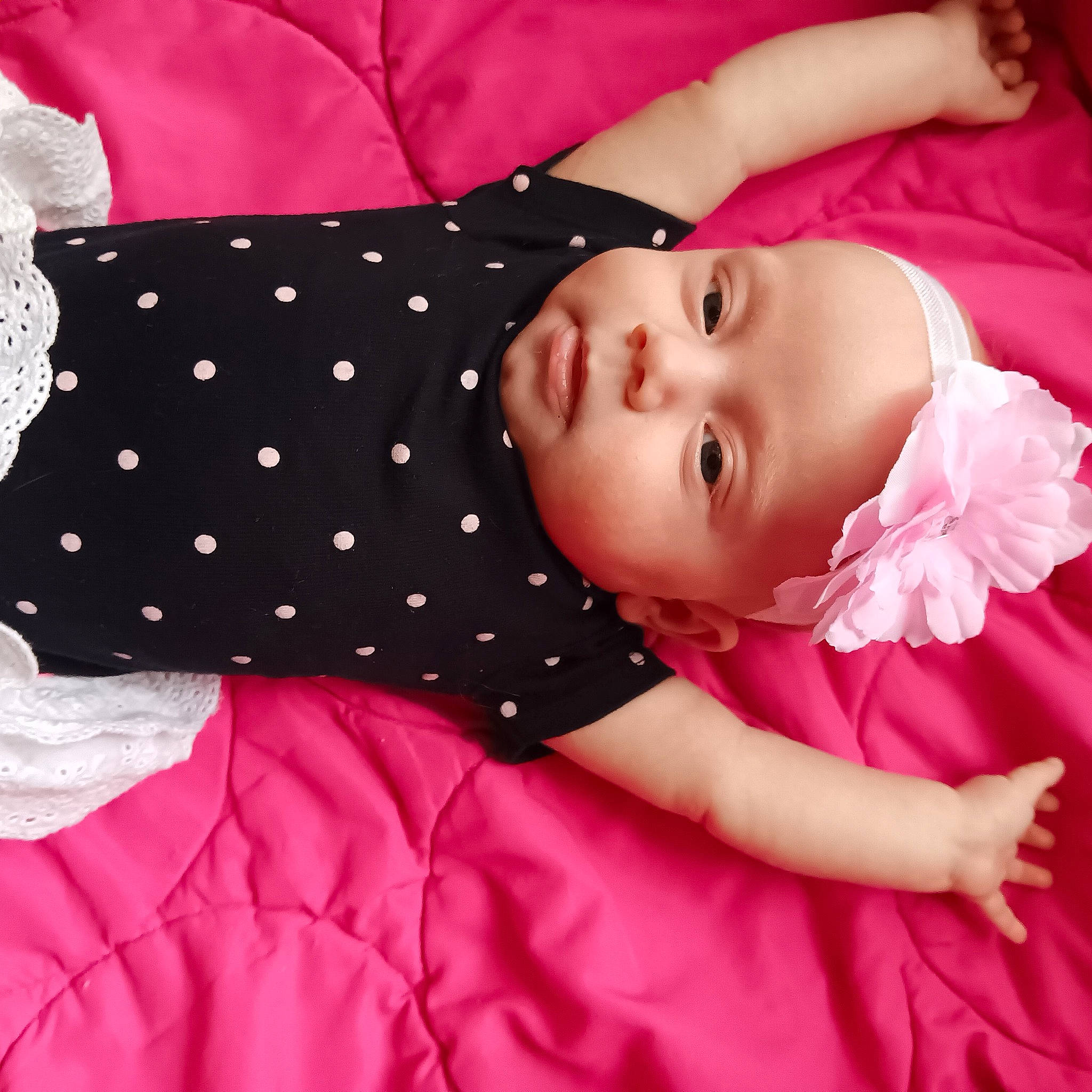 Angelica is registered to the contest to win money with this photo: baby, baby_products, baby_toddler_clothing, child, comfort, day_dress, eyelash, fashion_accessory, happy, linens, magenta, pattern, peach, person, petal, pink, polka_dot, red, sleeve, textile
