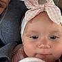 baby, child, headband, bow, pink, blanket, clothing, face, closeup, person, infant, indoor, soft_lighting, cute, adorable, warm, cozy, partial_face, portrait, young