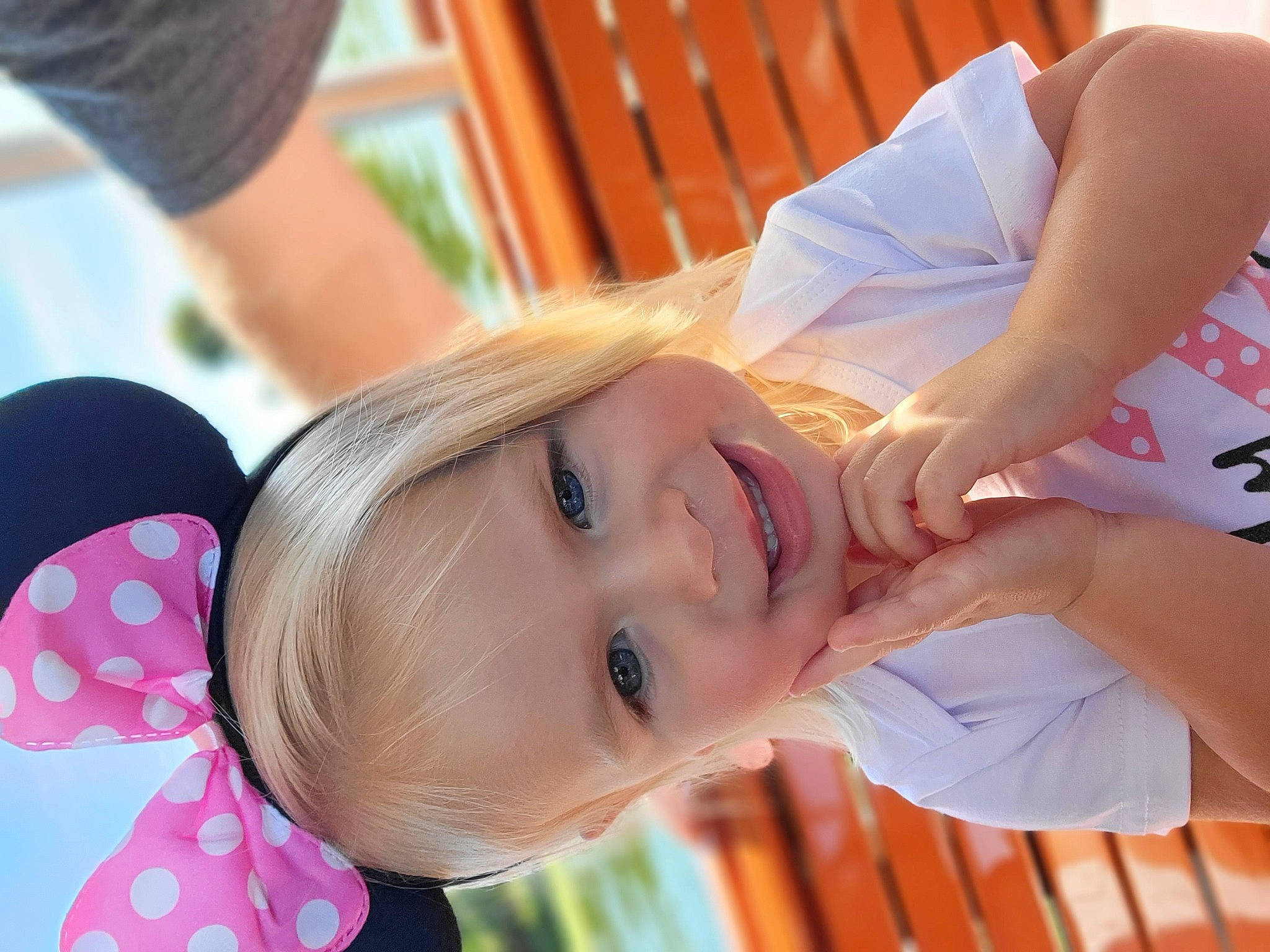 Macy is registered to the contest to win money with this photo: dress, eyelash, facial_expression, fun, gesture, glasses, grass, happy, joint, joy, leisure, lip, organ, people_in_nature, person, plant, skin, smile, summer, toddler