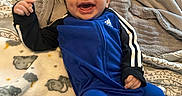 Jaxton Rice is registered to the contest to win money with this photo: baby, babylaughing, bed, blanket, clothing, coat, cushion, face, furniture, happy, head, homedecor, jacket, laughing, pants, person, photography, portrait, quilt, smile