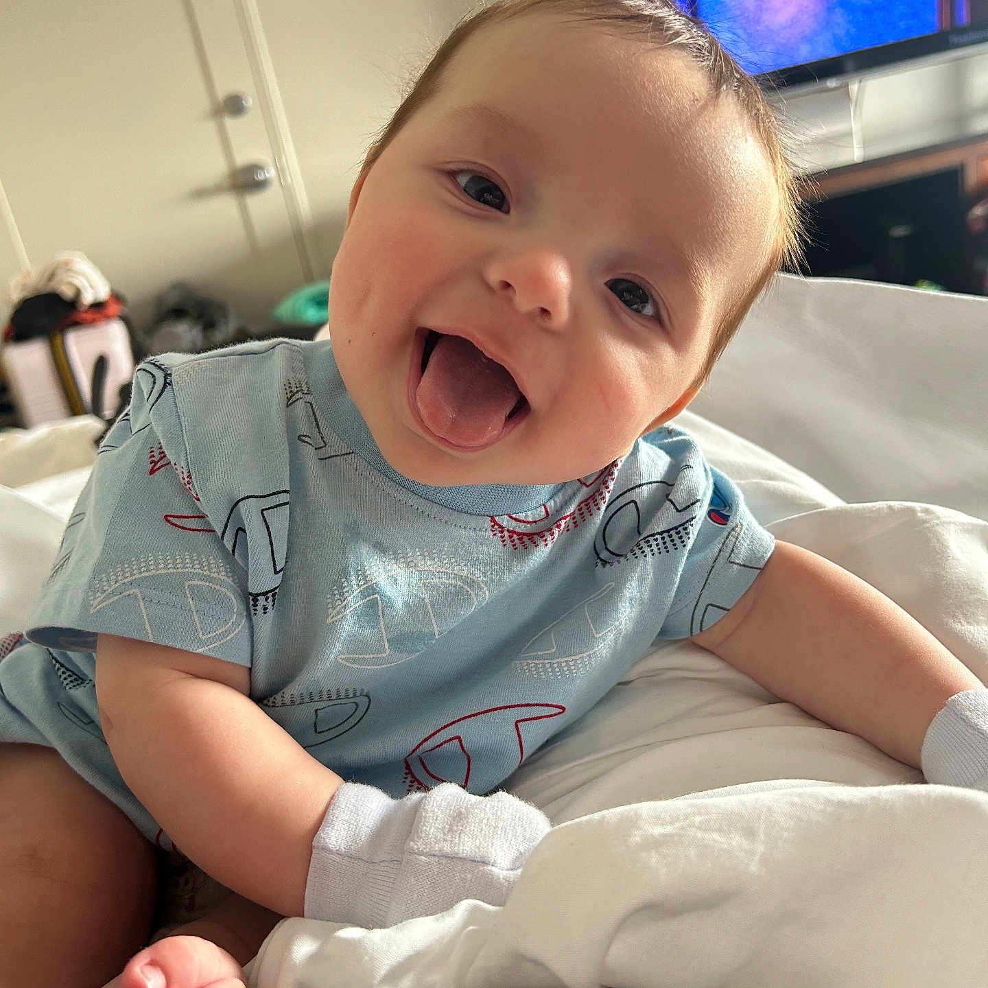 Jaxton Rice is registered to the contest to win money with this photo: baby, babylaughing, bodypart, clothing, computerhardware, electronics, face, finger, glove, happy, hardware, head, laughing, monitor, person, photography, portrait, screen, smile, tv