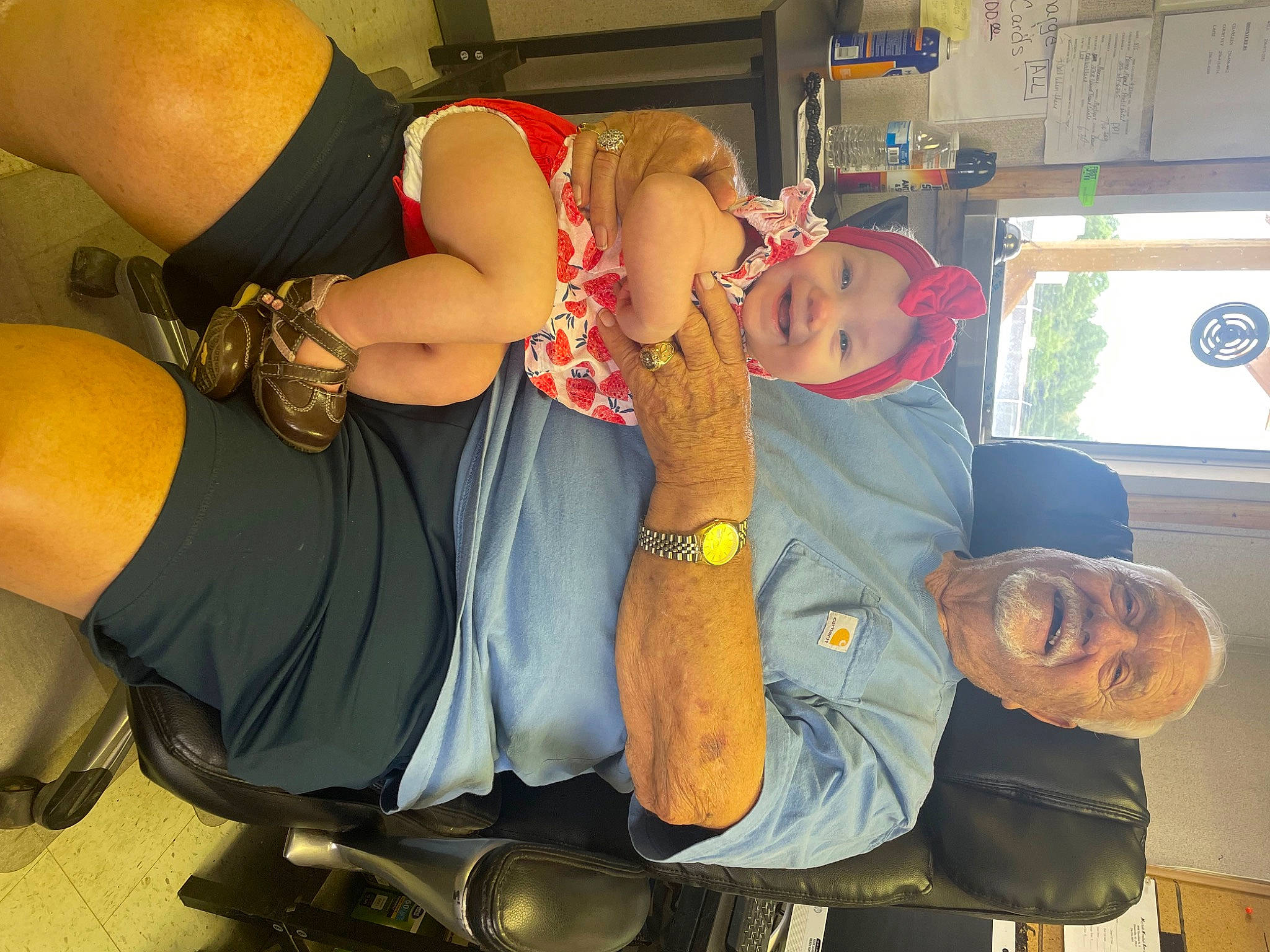 Ava is registered to the contest to win money with this photo: abdomen, chair, chest, clothing, comfort, elbow, eyewear, fun, hat, headgear, headwear, human_leg, jewellery, joy, knee, lap, person, room, sitting, smile