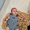 baby, blanket, blue_overalls, brown_blanket, changing_table, child, close_up, clothing, cute, denim_overalls, face, gingham_shirt, hand, indoor, infant, lying_down, nail_art, newborn, portrait, teddy_bear