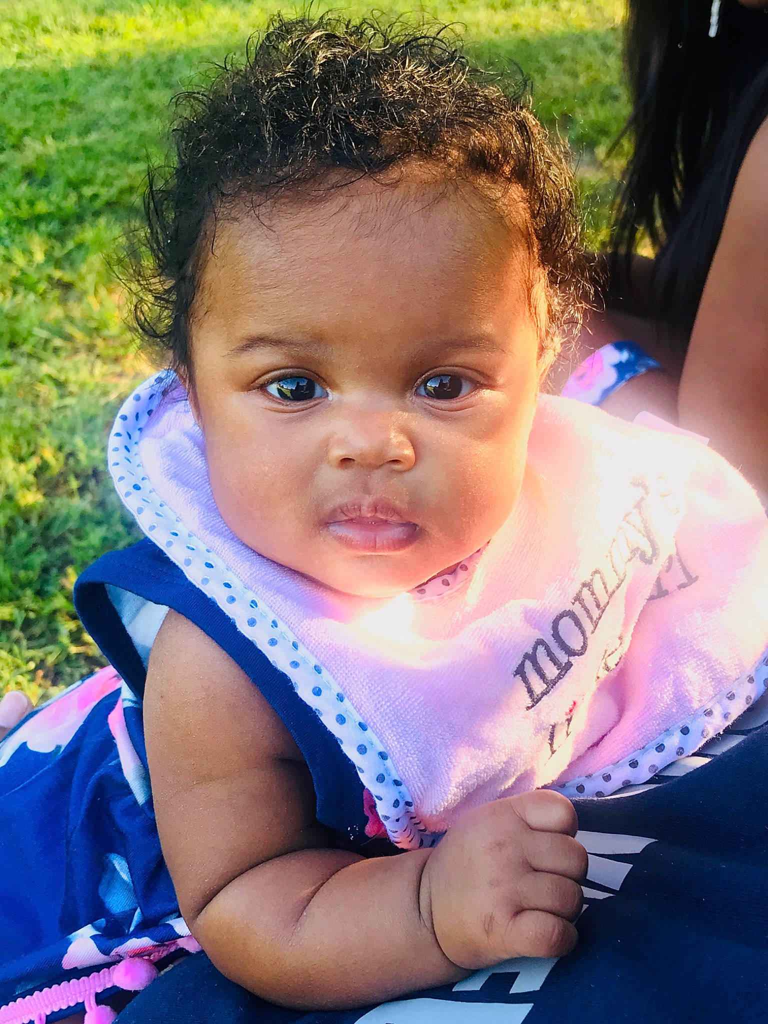 Storm joined the competition — help win amazing prizes! baby, cheek, child, eye, face, fun, grass, hair, happy, head, iris, lip, nose, person, recreation, sitting, skin, smile, summer, toddler