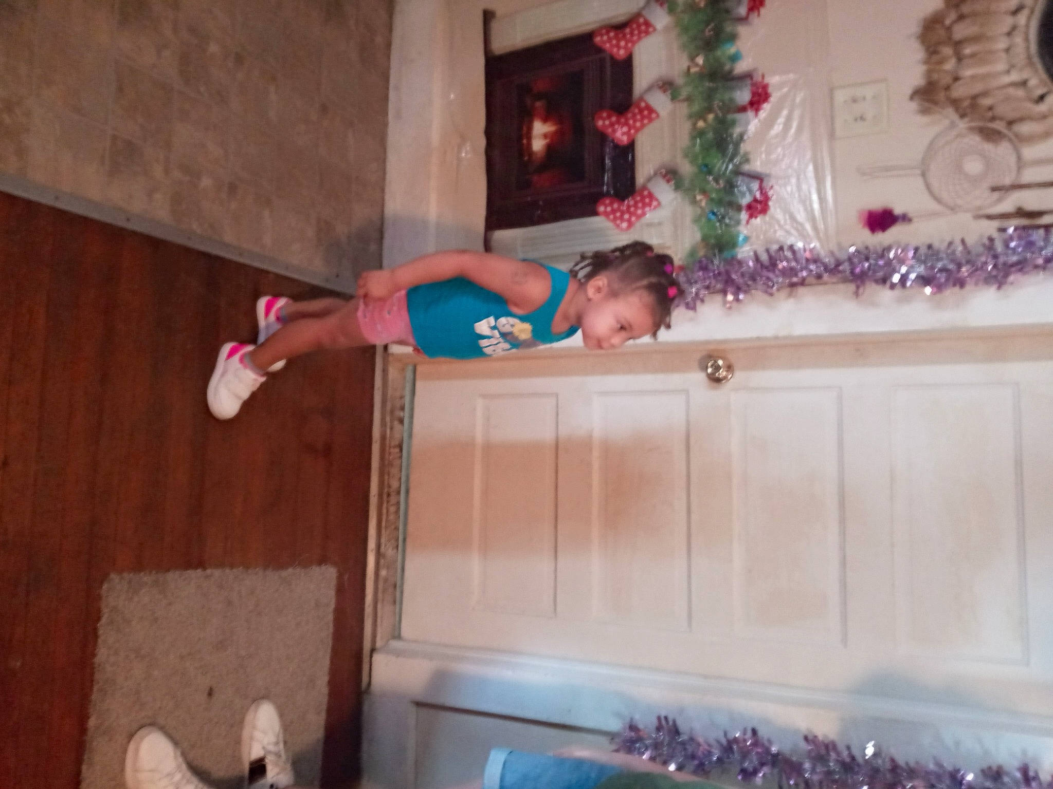 Raelynn is registered to the contest to win money with this photo: christmas, christmas_decoration, christmas_eve, christmas_lights, christmas_ornament, christmas_tree, decoration, elbow, fir, holiday, holiday_ornament, human_leg, molding, ornament, person, pine, pink, tradition, varnish, wood_stain