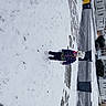 Raelynn is registered to the contest to win money with this photo: freezing, frost, geological_phenomenon, glacial_landform, ice, ice_cap, outdoor_shoe, playing_in_the_snow, precipitation, slope, snow, winter
