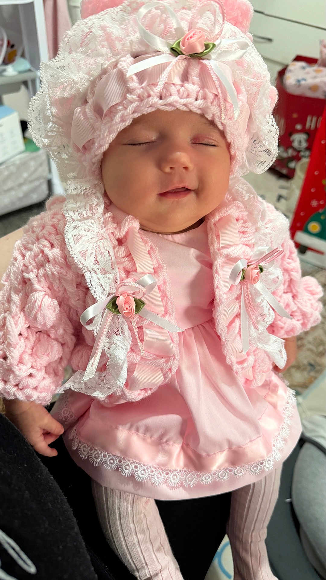 Sumayah is registered to the contest to win money with this photo: adorable, baby, bonnet, child, closeup, clothing, cozy, cute, dress, hand, indoors, infant, lace, person, pink, portrait, ribbons, sleeping, soft, tights