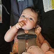 Serena joined the competition — help win amazing prizes! baby, child, car_seat, straps, thumb_sucking, plush_toy, pink_clothing, curly_hair, face, eyes, hand, comfort, indoors, child_safety, infant, cute, chicco, seat_belt, close_up, portrait