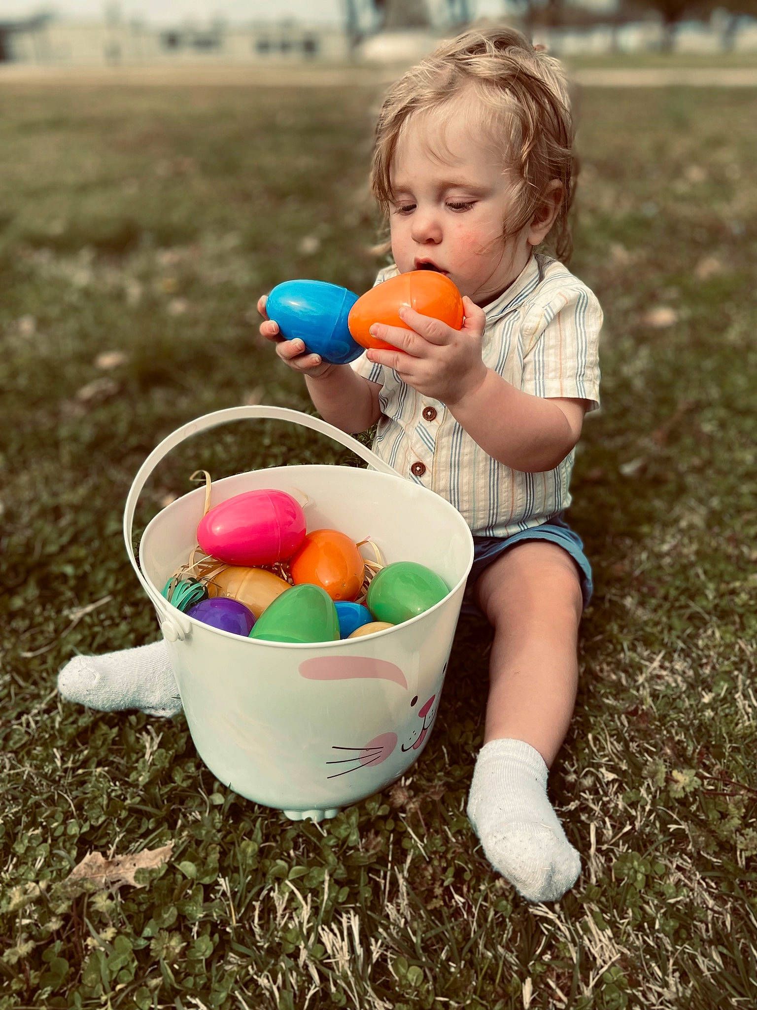 Braxley joined the competition — help win amazing prizes! baby, ball, basket, child, easter, easter_egg, event, fun, grass, happy, holiday, leisure, people, people_in_nature, person, play, recreation, sitting, sorrow, spring