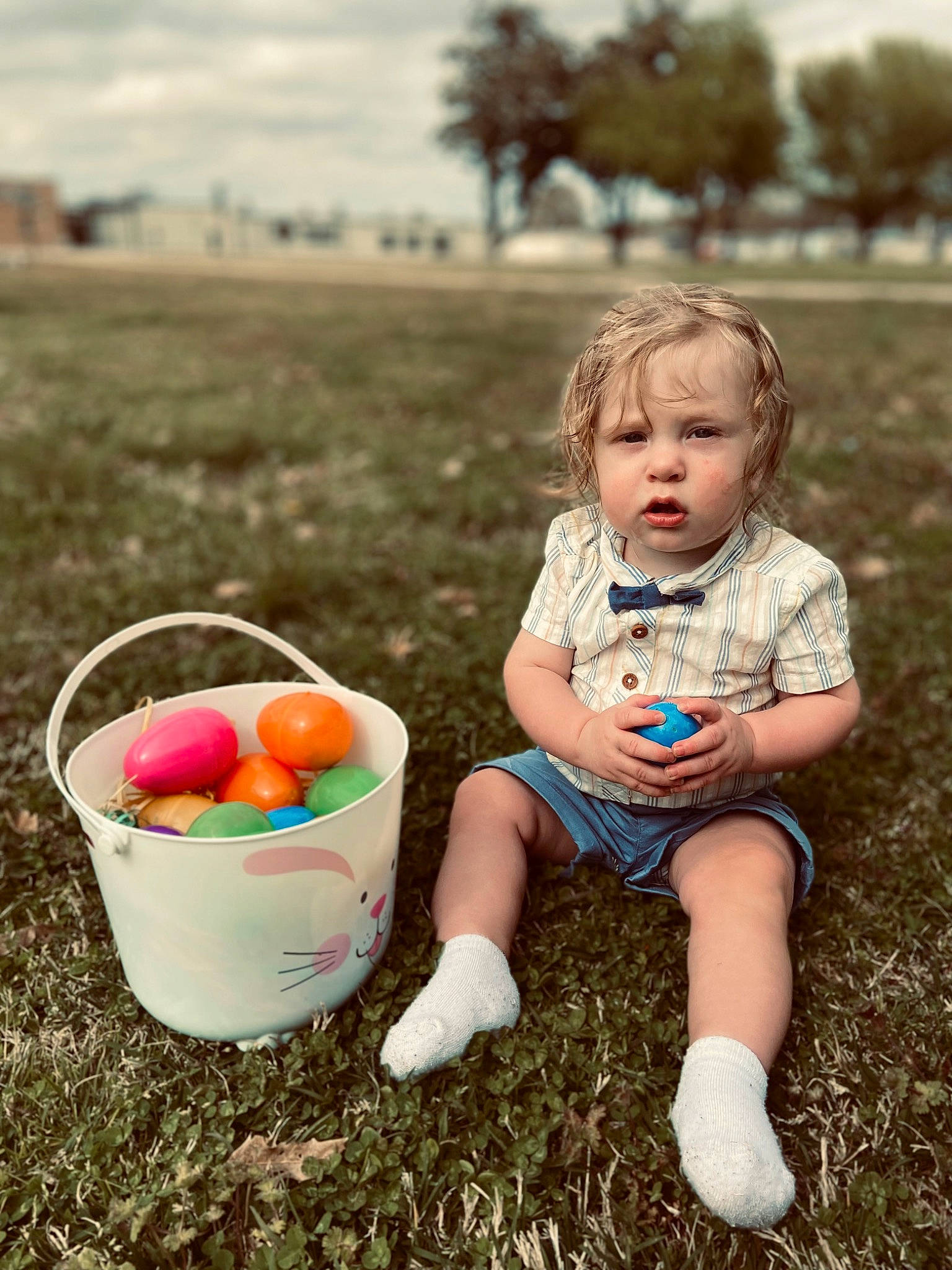 Braxley is registered to the contest to win money with this photo: baby, baby_toddler_clothing, basket, child, cloud, easter, easter_egg, event, fun, grass, happy, leisure, people_in_nature, person, plant, recreation, sky, summer, sunlight, toddler