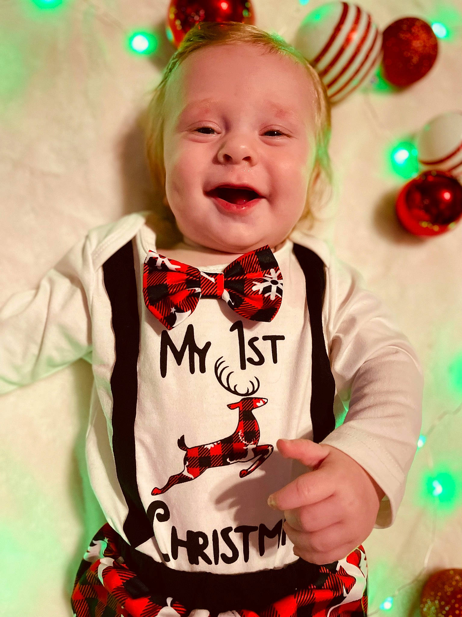 Braxley joined the competition — help win amazing prizes! baby_toddler_clothing, child, christmas, christmas_decoration, christmas_eve, christmas_ornament, event, fictional_character, fun, green, happy, head, holiday, holiday_ornament, party_supply, person, red, sleeve, smile, toddler