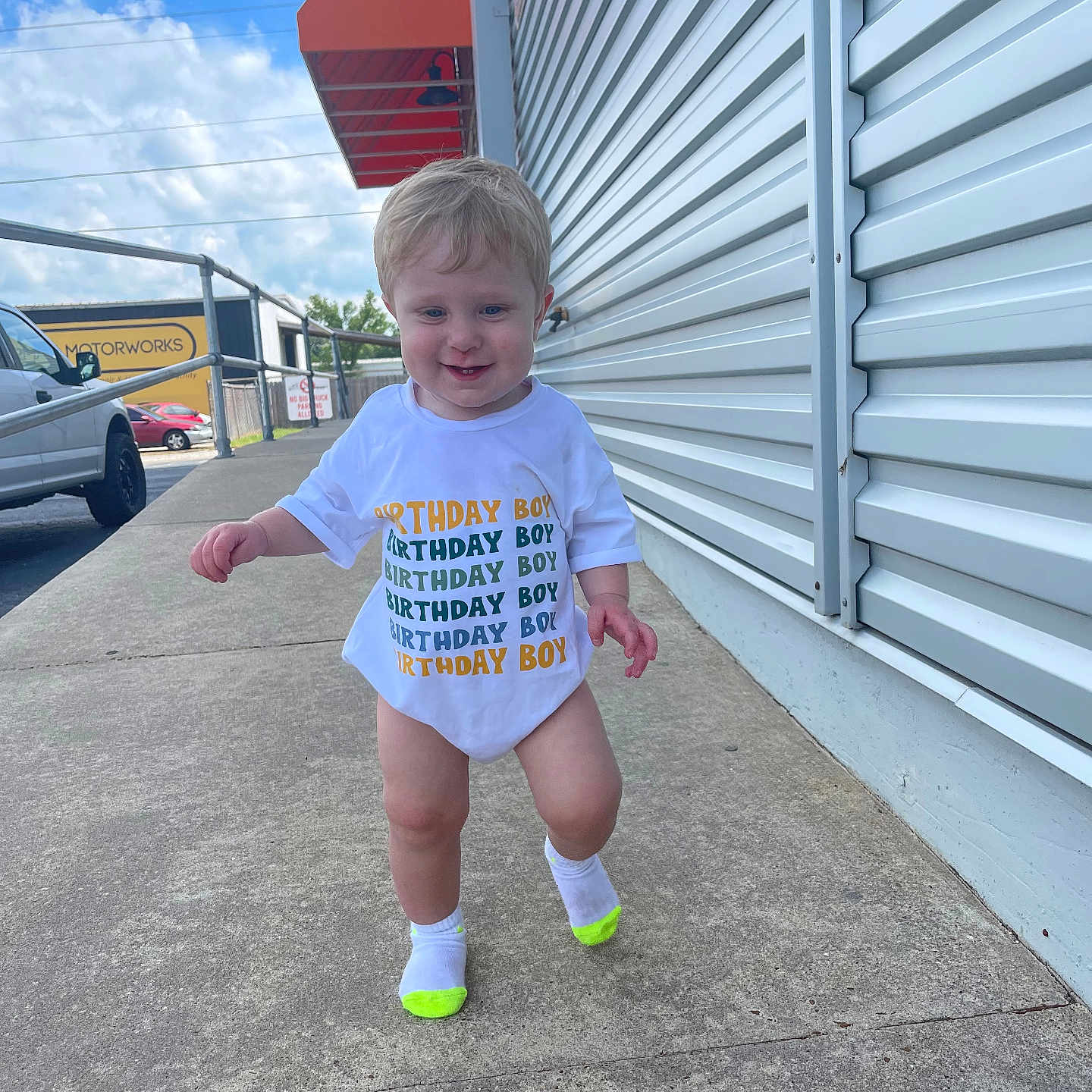 Braxley joined the competition — help win amazing prizes! architecture, building, city, clothing, face, head, hosiery, outdoors, path, person, photography, portrait, road, shelter, shorts, sidewalk, street, t_shirt, urban, walking