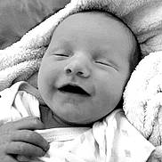 Kavick joined the competition — help win amazing prizes! baby, infant, smiling, blanket, clothing, hand, face, sleeping, newborn, portrait, cute, soft_texture, black_and_white, cozy, happy, peaceful, resting, child, closeup, babywear