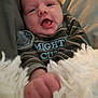 Kavick joined the competition — help win amazing prizes! baby, infant, face, hand, blanket, clothing, striped_shirt, pacifier, cute, expression, mouth_open, tongue_out, fist, soft_texture, indoor, close_up, child, newborn, portrait, cozy