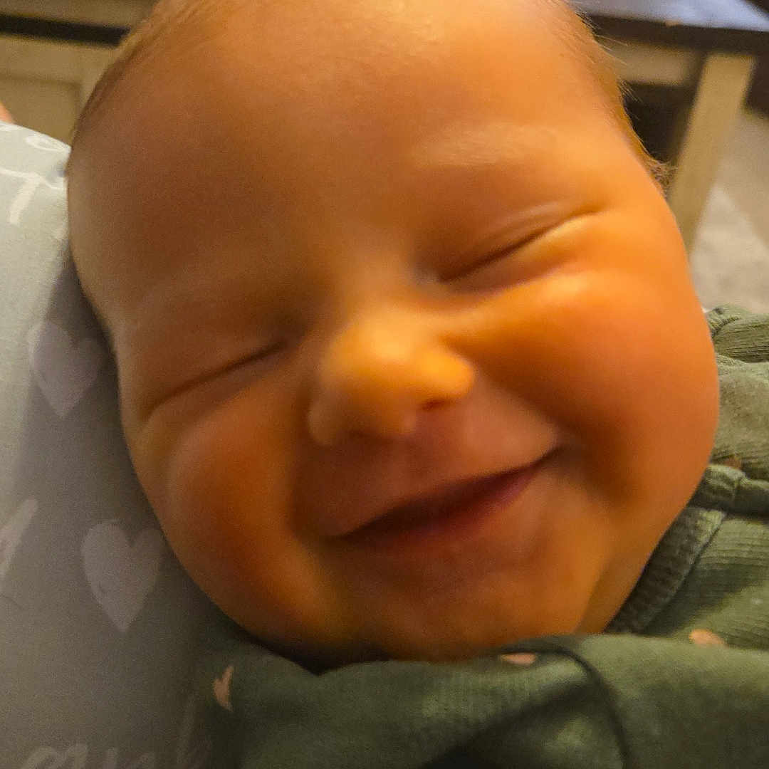 Delaney joined the competition — help win amazing prizes! architecture, baby, bodypart, building, cushion, face, furniture, happy, head, homedecor, hospital, indoors, laughing, newborn, person, photography, portrait, quilt, sleeping, smile