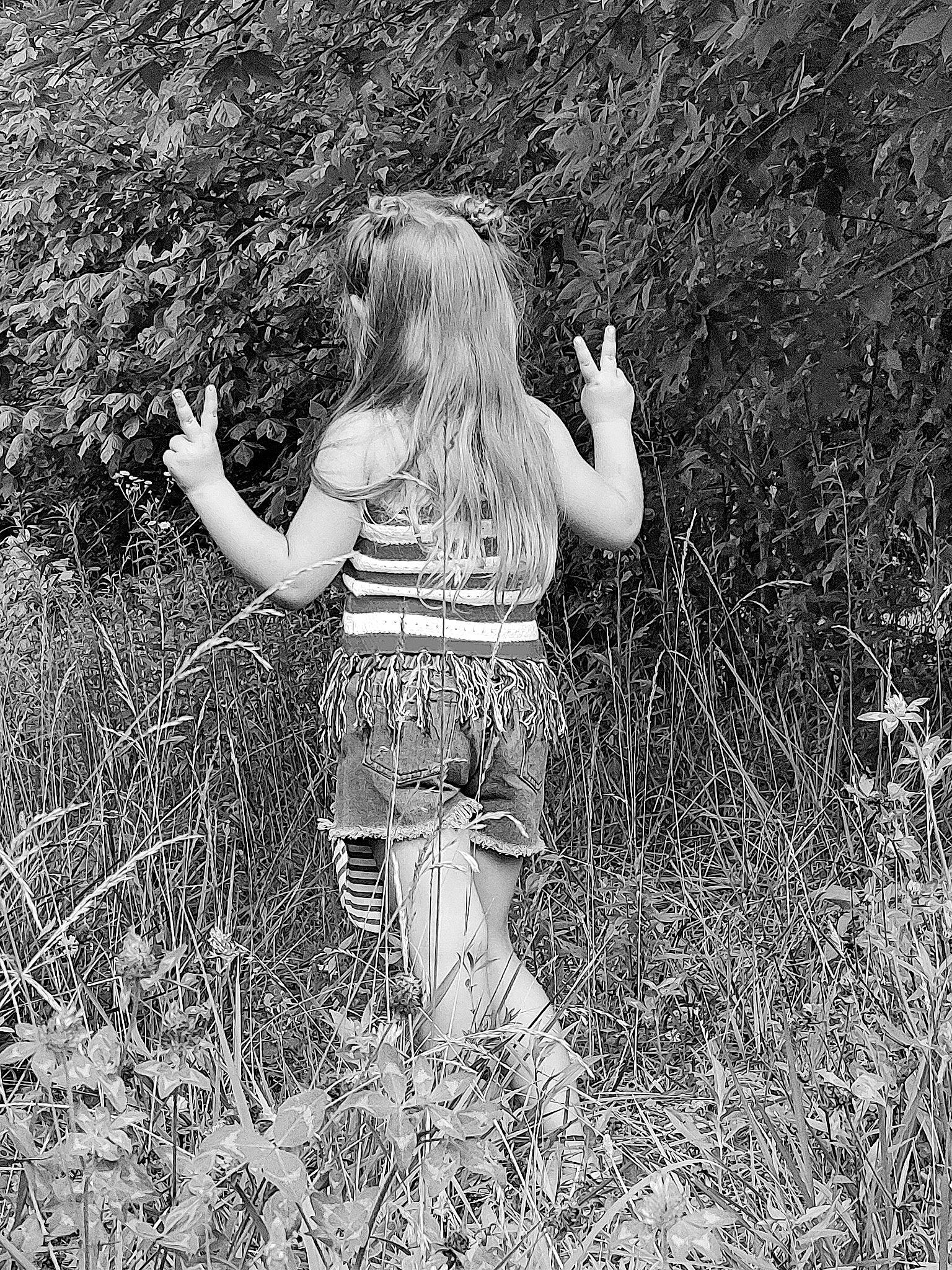 Braylee joined the competition — help win amazing prizes! black_and_white, blond, field, fun, gesture, grass, grass_family, grassland, happy, human_leg, long_hair, meadow, monochrome, monochrome_photography, people_in_nature, person, plant, prairie, soil, style