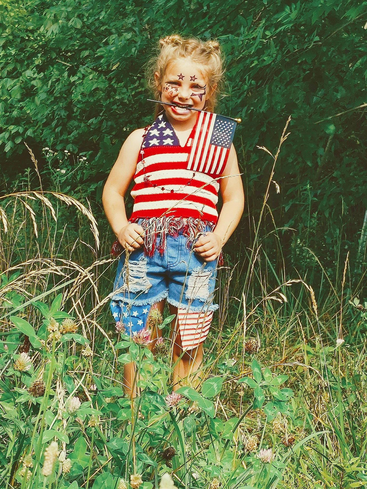 Braylee is registered to the contest to win money with this photo: denim, forest, fun, grass, grass_family, grassland, happy, human_leg, jungle, leisure, natural_environment, pattern, people_in_nature, person, plaid, plant, shorts, soil, t_shirt, tree