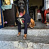 dog, pet, animal, steps, clothing, shirt, skeleton_design, tongue_out, outdoor, doorway, plants, table, checkered_cloth, concrete, house, floor, happy, brown, black, cute
