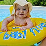 baby, smiling, inflatable_ring, pool, water, hat, sun_hat, child, outdoor, summer, yellow, blue, green, floating, happy, cute, infant, person, swimming_pool, nature